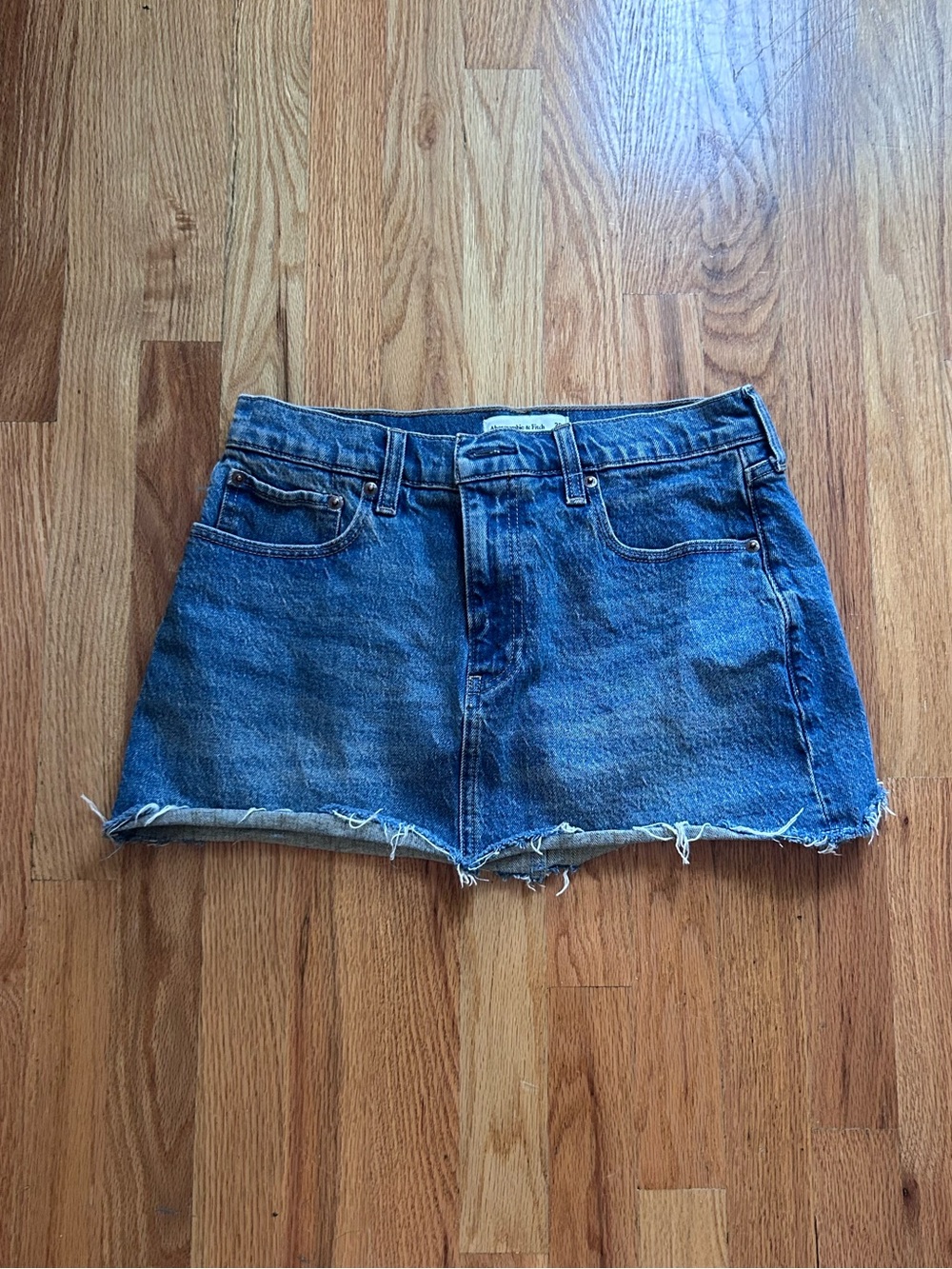 Denim Cutoff Mini Skirt in Medium Blue